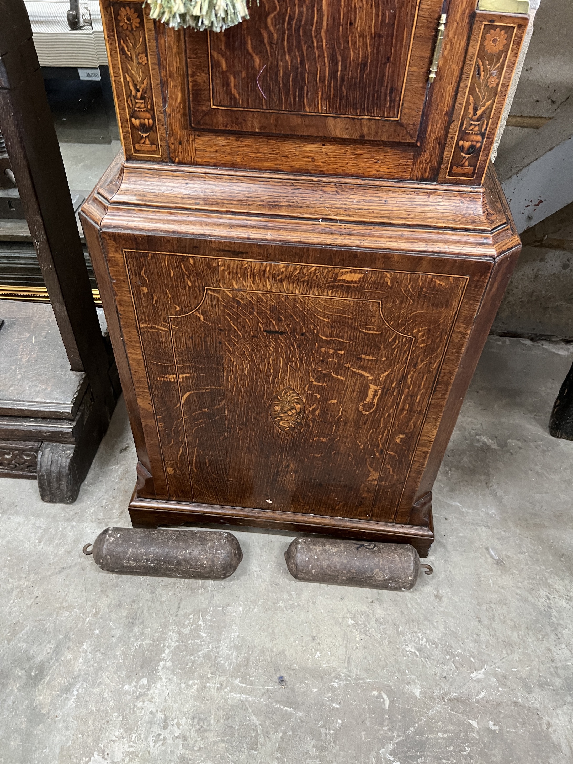 A late 18th century mahogany banded oak eight day longcase clock, with an arched painted dial marked Lanley, Wellington, height 228cm